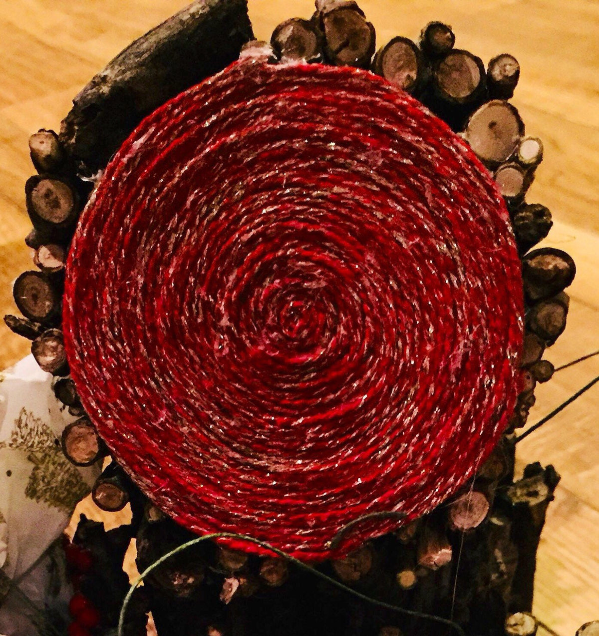 Red and gold glitter twine on wooden spool, view 2