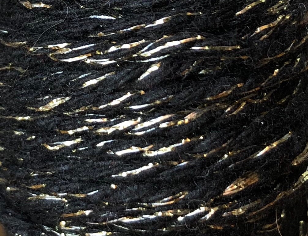 Black and gold glitter twine on wooden spool, view 2