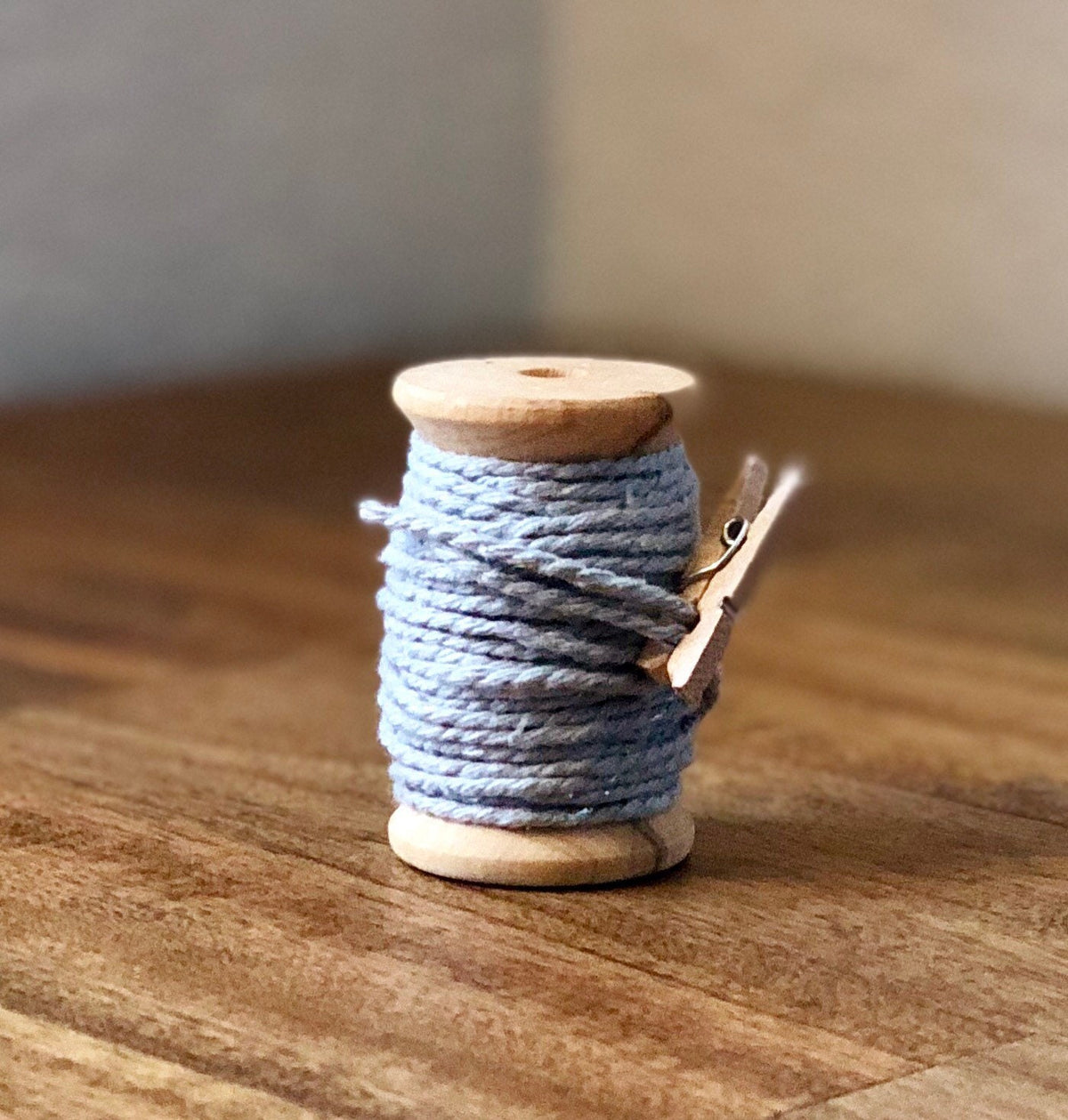 Grey and silver glitter twine on wooden spool