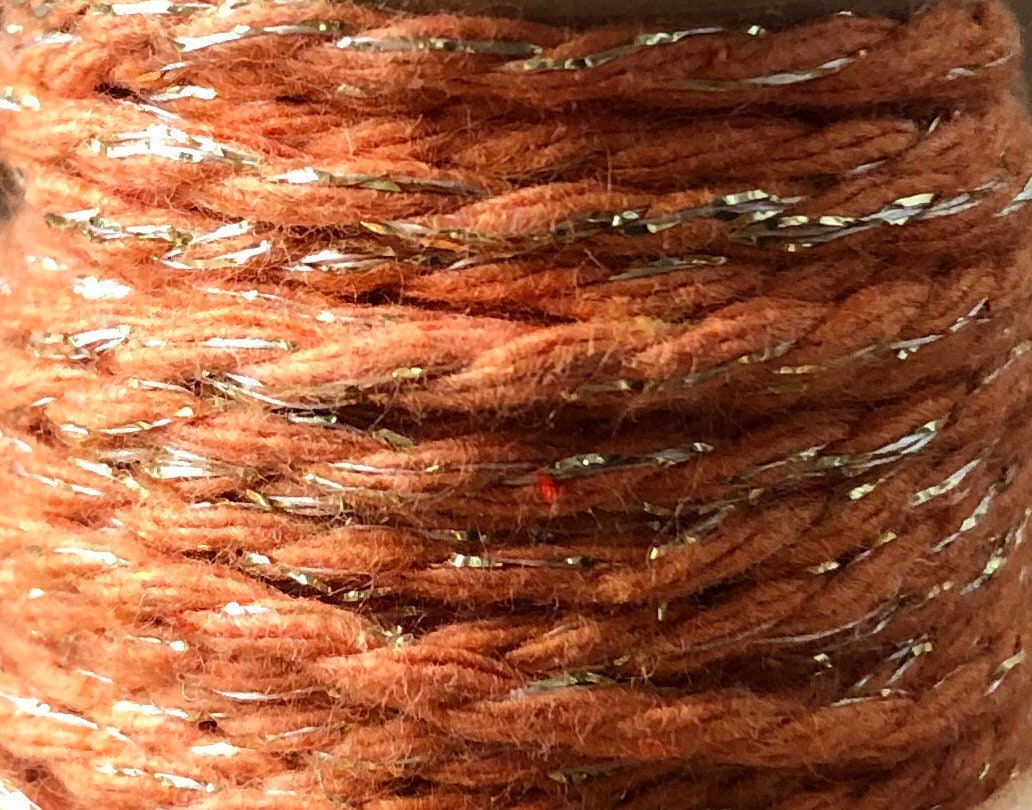 Orange and gold glitter twine on wooden spool, view 2