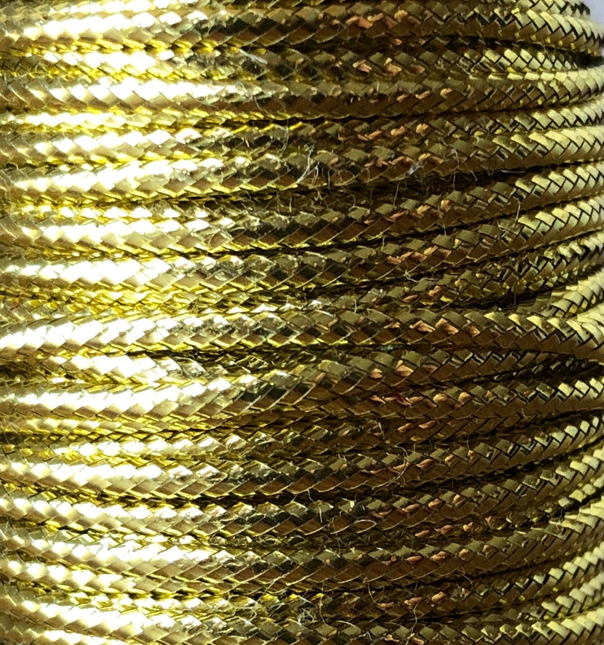 Gold nylon cord on wooden spool, view 2
