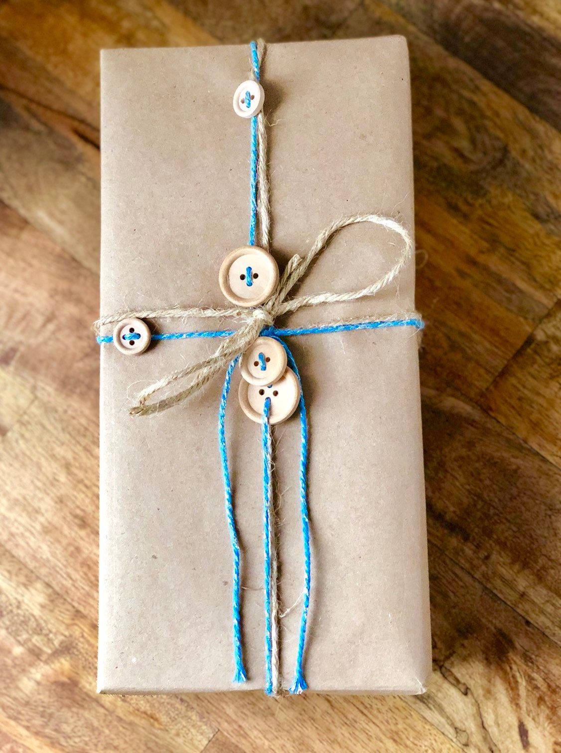 Sky blue and silver glitter twine on wooden spool, view 3