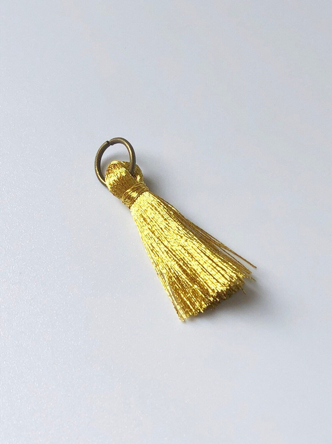 Gold and silver mini tassels with jump rings, view 3