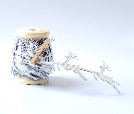 Silver reindeer Christmas lace trim on wooden spool