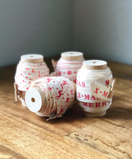 Cotton Christmas ribbon on wood spool