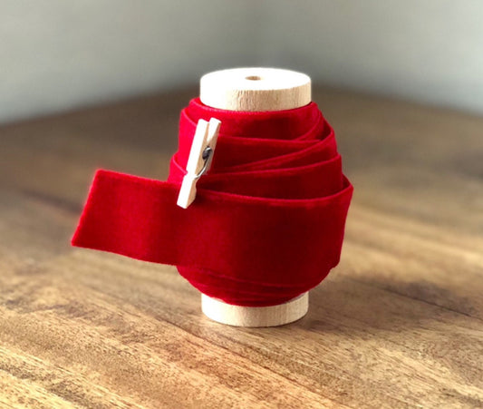 Red velvet ribbon, 1 inch wide, on spool