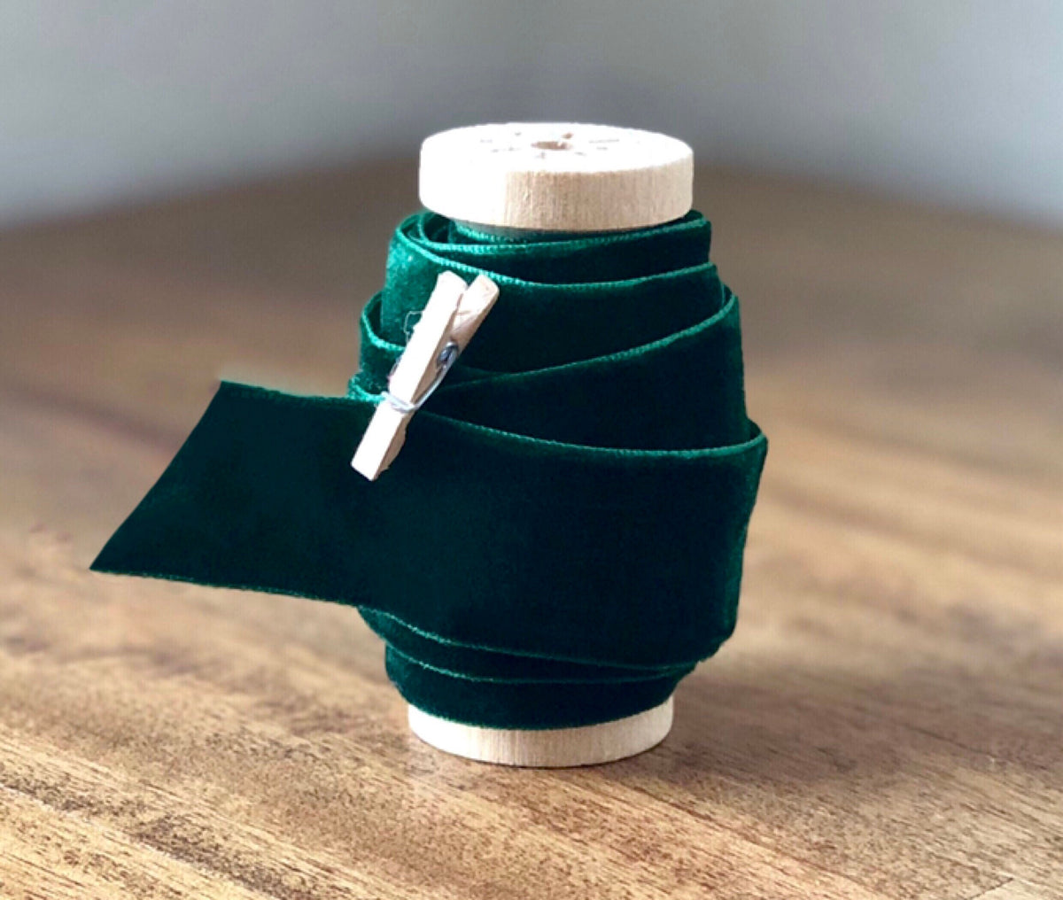 Dark green velvet ribbon, 1 inch wide, on spool