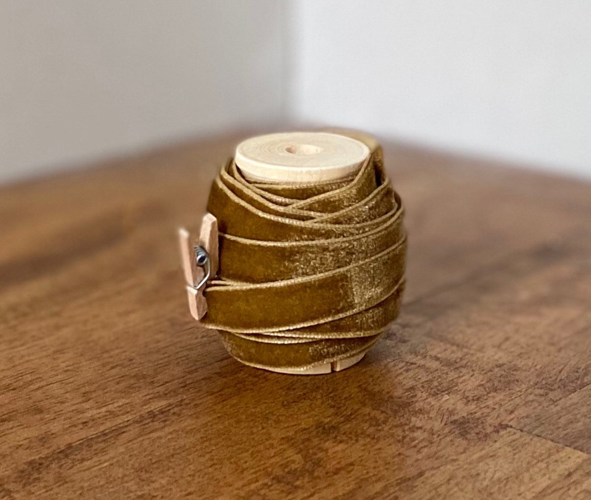 Latte brown velvet ribbon on wooden spool