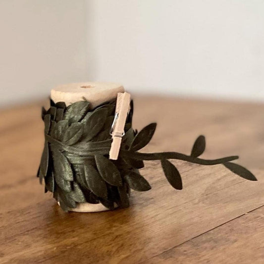 Olive green satin leaf ribbon on wooden spool
